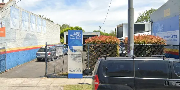 ADM Motors on Hawthorn Road: the blue wall with the red and yellow stripe